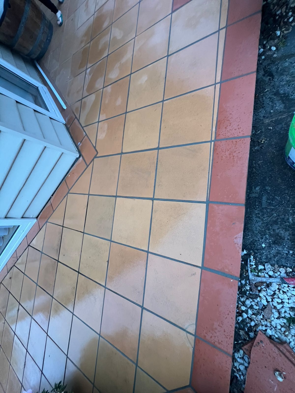Outdoor terracotta paver border after tile replacement and fresh joint grouting — Melbourne