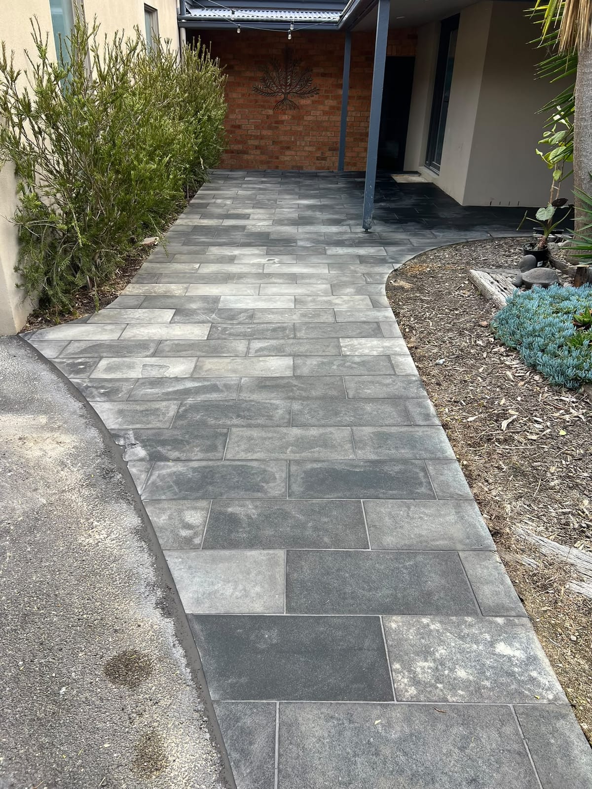 Outdoor grey paver pathway after full joint grouting and cleaning — Melbourne