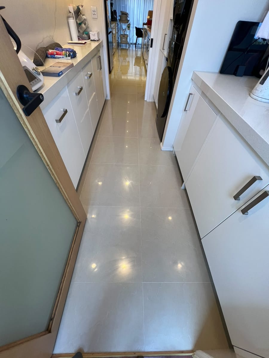 Kitchen floor tiles restored and sealed with stain-resistant epoxy grout
