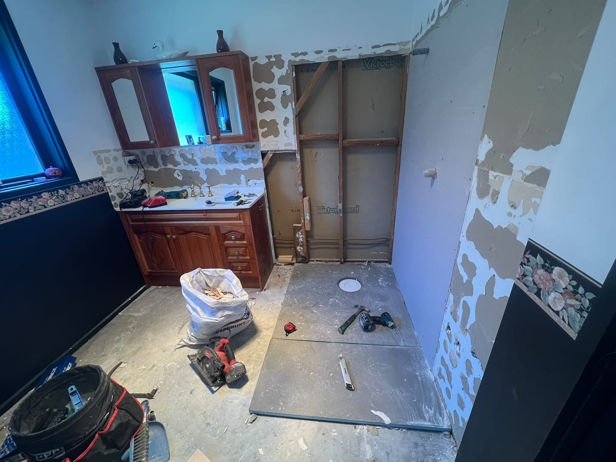 Epoxy grout applied to mosaic and large format tiles in a modern bathroom shower