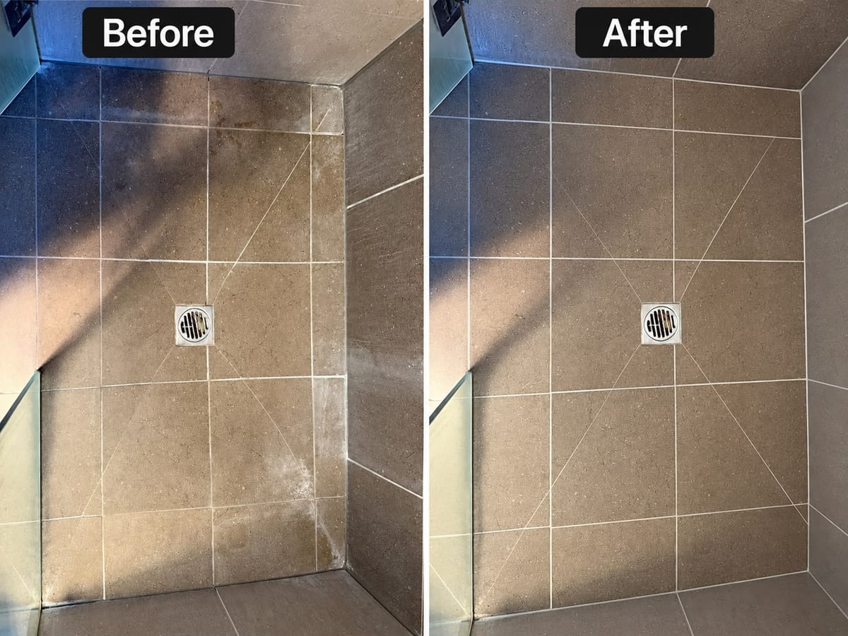 Walk-in shower with waterproof epoxy grouted feature wall and floor tiles