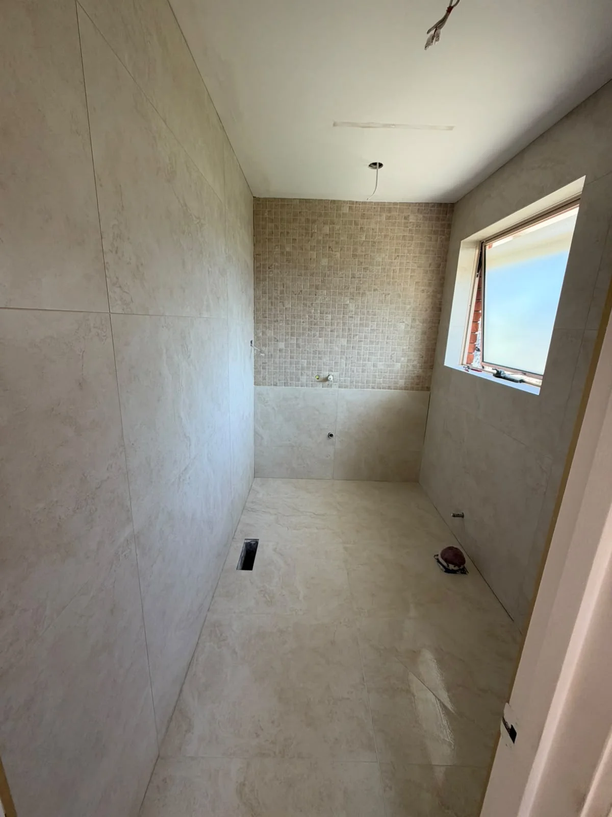 Completed porcelain bathroom tiling and textured mosaic shower feature wall — Melbourne