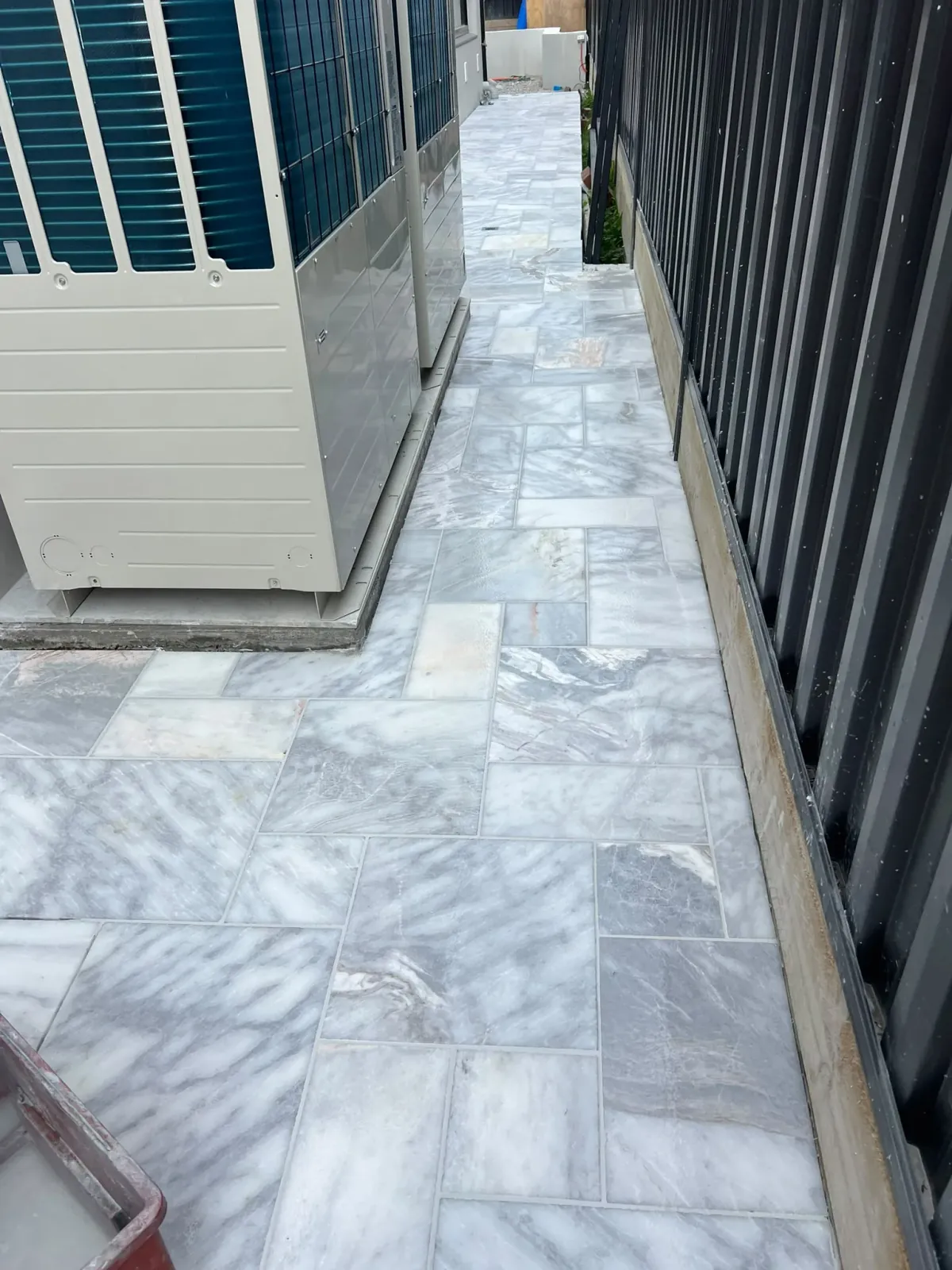 Outdoor side pathway stone pavers with tightly packed weather-resistant mortar joints — Melbourne